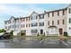 Townhome complex featuring multiple units with well-maintained parking lot at 8610 Neuse Landing Ln # 103, Raleigh, NC 27616