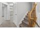 Hallway view with carpeted stairs and access to multiple rooms at 8610 Neuse Landing Ln # 103, Raleigh, NC 27616