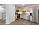 Kitchen features stainless steel appliances, wood cabinets, and sleek countertops at 8610 Neuse Landing Ln # 103, Raleigh, NC 27616