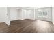 Minimalist living room design with hardwood floors and ample natural light at 8610 Neuse Landing Ln # 103, Raleigh, NC 27616