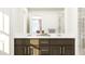 Bathroom vanity with dual sinks, a granite countertop, dark cabinets, and a shower at 88 Blossom Field Way, Angier, NC 27501