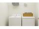 Bright laundry room featuring a washer, dryer, and ample storage space at 88 Blossom Field Way, Angier, NC 27501