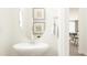 Modern powder room with a stylish sink, mirror, and decor at 88 Blossom Field Way, Angier, NC 27501