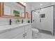 Modern bathroom with double vanity, black fixtures, and walk-in shower with subway tile at 908 W Garden St, Sanford, NC 27330
