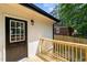 Warm wooden deck provides access to the fenced-in backyard at 908 W Garden St, Sanford, NC 27330