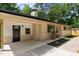 Charming front exterior with rocking chairs on the large front porch at 908 W Garden St, Sanford, NC 27330