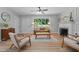 Inviting living room featuring a fireplace, wood flooring, and comfortable seating at 908 W Garden St, Sanford, NC 27330