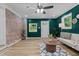 Inviting living space featuring a brick wall and a large window overlooking green outdoors at 908 W Garden St, Sanford, NC 27330