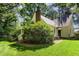 Charming home with a well-maintained backyard, lush greenery, and a partially screened back porch at 9417 Greenfield Dr, Raleigh, NC 27615