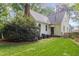 Charming home with a well maintained backyard surrounded by mature trees and lush greenery at 9417 Greenfield Dr, Raleigh, NC 27615