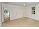 Spacious bedroom with double closets, neutral carpet, and doorway view to another room at 9417 Greenfield Dr, Raleigh, NC 27615