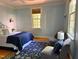 Bedroom featuring two lounge chairs and a large window at 9417 Greenfield Dr, Raleigh, NC 27615