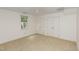 Bedroom featuring carpet floors, double closets, a ceiling fan, and natural light at 9417 Greenfield Dr, Raleigh, NC 27615
