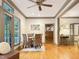 Cozy dining area with a ceiling fan, hardwood floors, and lots of natural light at 9417 Greenfield Dr, Raleigh, NC 27615