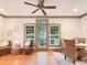 Bright dining area with hardwood floors, windows, and seating for four, creating an inviting meal space at 9417 Greenfield Dr, Raleigh, NC 27615