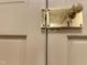 Close up of antique door hardware showing a tarnished golden knob and aged features at 9417 Greenfield Dr, Raleigh, NC 27615