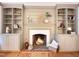 Close up of fireplace with built in shelves and cabinets on either side at 9417 Greenfield Dr, Raleigh, NC 27615