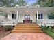 Inviting front porch features double entry doors, and a brick pathway at 9417 Greenfield Dr, Raleigh, NC 27615