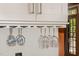 Kitchen features a wine glass rack hanging from the cabinet, adding a touch of sophistication at 9417 Greenfield Dr, Raleigh, NC 27615