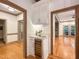 A kitchen bar area with wine cooler, cabinet storage and is conveniently located between two rooms at 9417 Greenfield Dr, Raleigh, NC 27615