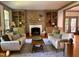 Bright living room features a fireplace and built-in bookshelves at 9417 Greenfield Dr, Raleigh, NC 27615