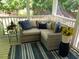 Cozy screened porch features cushioned seating, providing a relaxing outdoor living space at 9417 Greenfield Dr, Raleigh, NC 27615