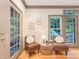 Relaxing sitting area with chairs, and natural light, enhanced by wood floors and neutral decor at 9417 Greenfield Dr, Raleigh, NC 27615