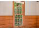 View of a window with wood trim and view of trees outside at 9417 Greenfield Dr, Raleigh, NC 27615