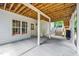Covered patio with string lights, offering a cozy and stylish outdoor space with access to backyard at 1001 Dairy House Ct, Wake Forest, NC 27587