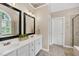 Bathroom featuring double vanity and mirrors, and a stand-up shower at 1001 Dairy House Ct, Wake Forest, NC 27587