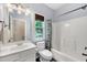 Bathroom with white vanity, tub/shower combination, and natural light from the window at 1001 Dairy House Ct, Wake Forest, NC 27587