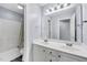Bright bathroom featuring double sinks, white cabinets and shower and bathtub at 1001 Dairy House Ct, Wake Forest, NC 27587
