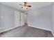 Simple bedroom with grey walls, carpet, and neutral decor at 1001 Dairy House Ct, Wake Forest, NC 27587