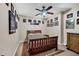 Bedroom with a wooden bedframe, ceiling fan and plenty of wall decorations at 1001 Dairy House Ct, Wake Forest, NC 27587