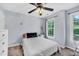Cozy bedroom with natural light from the window and a ceiling fan at 1001 Dairy House Ct, Wake Forest, NC 27587
