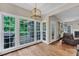 Bright breakfast nook boasts large windows with a view of the outdoor deck at 1001 Dairy House Ct, Wake Forest, NC 27587