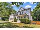 Beautiful two-story home with a charming front porch, lush green lawn and professional landscaping at 1001 Dairy House Ct, Wake Forest, NC 27587