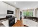 Well-equipped kitchen featuring white cabinets, granite countertops, and stainless steel appliances at 1001 Dairy House Ct, Wake Forest, NC 27587