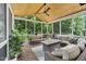 Inviting screened-in porch with comfortable seating, wood ceiling, and open views at 1001 Dairy House Ct, Wake Forest, NC 27587