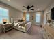 Inviting main bedroom with neutral tones, a ceiling fan, and bright windows that provide natural lighting at 1006 Starkville St, Durham, NC 27713