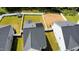An aerial view of the roof with solar panels and the yard enclosed by a white vinyl fence at 1016 Matterhorn Dr, Fuquay Varina, NC 27526