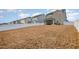 Backyard featuring large grass area, white fence, and view of homes at 1016 Matterhorn Dr, Fuquay Varina, NC 27526