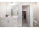 Bathroom featuring modern fixtures, white cabinets, and seamless access to a walk-in closet at 1016 Matterhorn Dr, Fuquay Varina, NC 27526