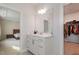 Bathroom featuring white cabinets, modern fixtures, and seamless access to the bedroom and walk-in closet at 1016 Matterhorn Dr, Fuquay Varina, NC 27526