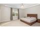 Tranquil bedroom features tray ceilings, modern lighting, and large windows, creating a serene retreat at 1016 Matterhorn Dr, Fuquay Varina, NC 27526
