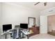 Bedroom with office space, ceiling fan, and dresser with a mirror at 1016 Matterhorn Dr, Fuquay Varina, NC 27526