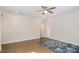 Bedroom with hardwood flooring, ceiling fan, and view to open doorway at 1016 Matterhorn Dr, Fuquay Varina, NC 27526