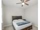This bedroom features carpet flooring and a bed with storage at 1016 Matterhorn Dr, Fuquay Varina, NC 27526