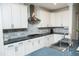 Modern kitchen featuring white cabinets, stainless steel appliances, and sleek countertops at 1016 Matterhorn Dr, Fuquay Varina, NC 27526