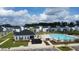 Aerial view showcases the community pool with clear water, seating and manicured landscaping at 1016 Matterhorn Dr, Fuquay Varina, NC 27526